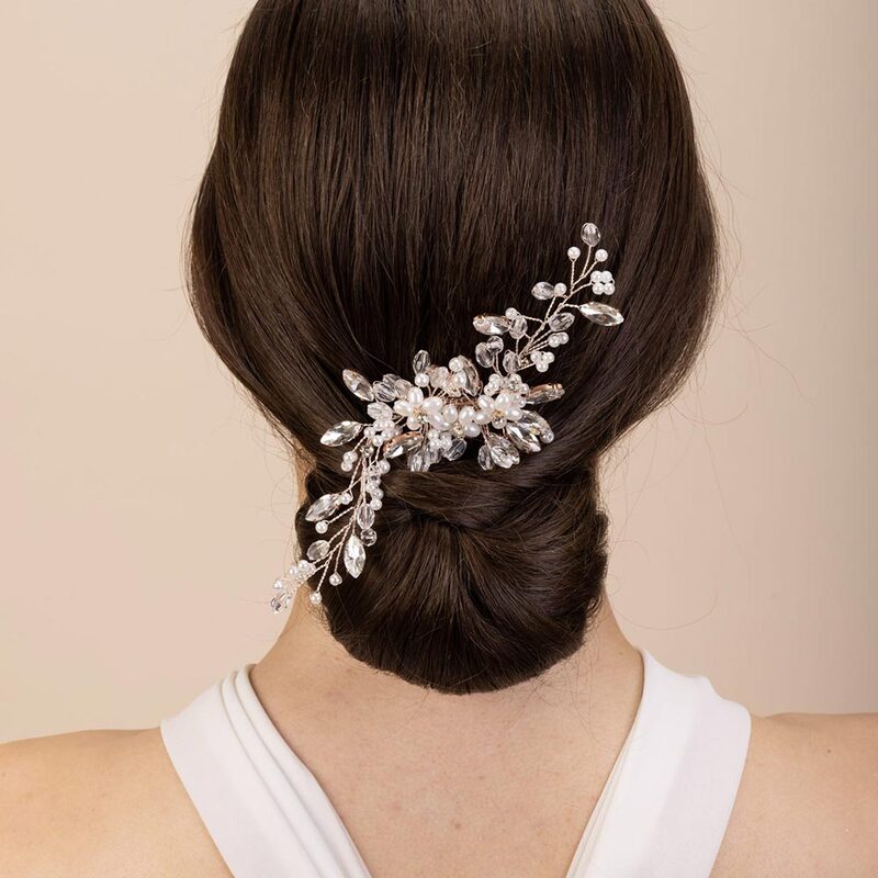 The stunning ivory pearl and silver diamanté hair comb would be suitable for any bridal look, available in rose gold and silver.