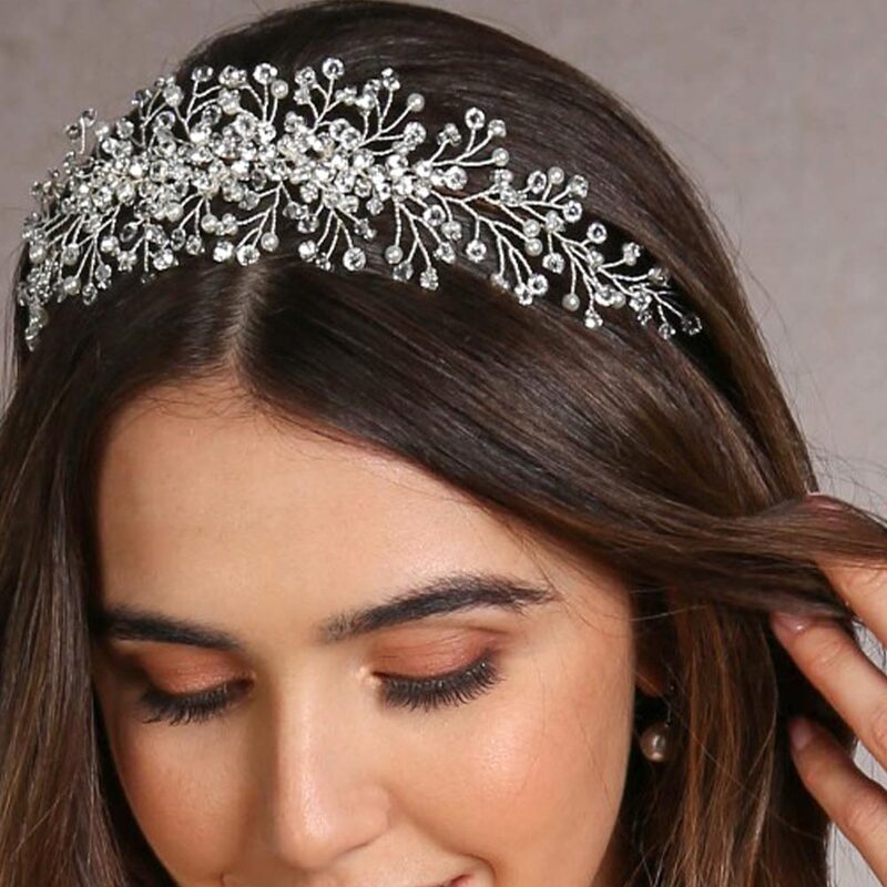 A delicate yet statement bridal tiara made from sparkling marquise diamantes and crystals bicone beads.