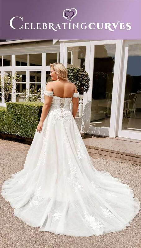 Plus size corset back bridal gown with flowy skirt