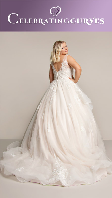 Bridal ball gown with a layered skirt for plus size curvy bride